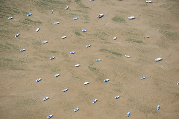 Aerial view of pleasure boats at low tide