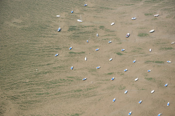 Aerial view of pleasure boats at low tide