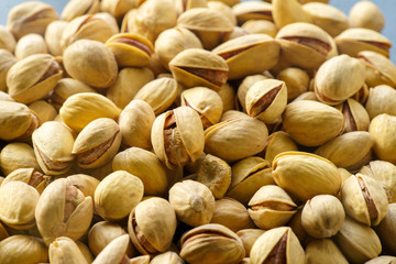 Pistachio nuts. A close-up photograph. Unrefined whole kernel 