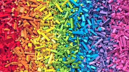 Foto op Plexiglas Kleuterschool Veel kleurrijke regenboog speelgoed bakstenen achtergrond