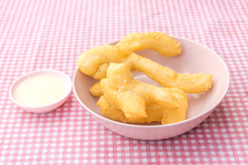 Youtiao deep fried dough stick a kind of Chinese flour sweet meal Chinese breakfast and Thailand called Pa Tong Ko eat with coffee or soy milk delicious morning street food dessert