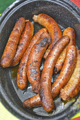 Roasted sausages in a bowl