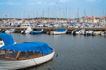 Pier with parked yachts in the marine town on the Southern cost of Sweden.