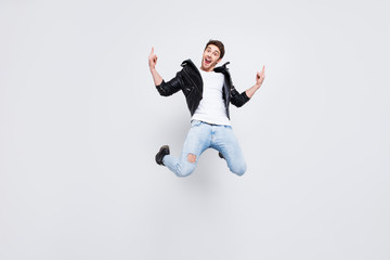 Fototapeta na wymiar Full-size full-length portrait Yes yeah hooray! Careless funky funny excited cheerful joyful emotional guy clothed in trendy modern spring outfit demonstrating horns symbol isolated on gray background