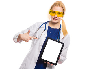 Woman doctor in white coat with tablet