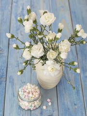 flowers white carnations on a wooden background. 
