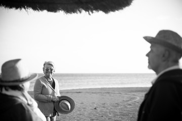 Naklejka premium elderly group on the beach in winter