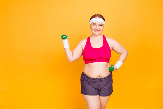 Young woman exercises with hand weights