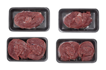 Supermarket plastic tray with veal isolated on white background. Top view