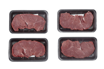 Supermarket plastic tray with veal isolated on white background. Top view
