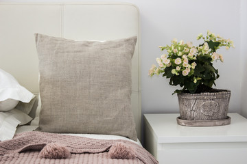 Fototapeta na wymiar Natural pillow on bed in a cozy bedroom, Mockup