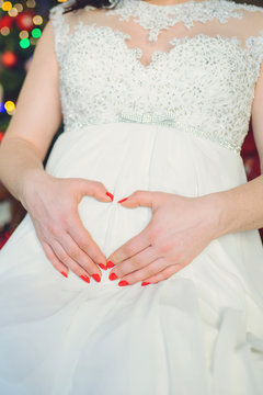 Pregnant Bride Holding Hands on Belly