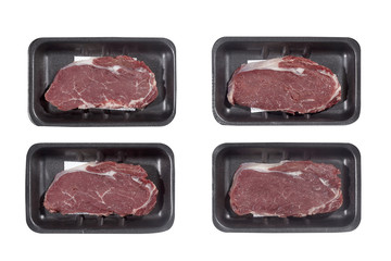 Supermarket plastic tray with veal isolated on white background. Top view
