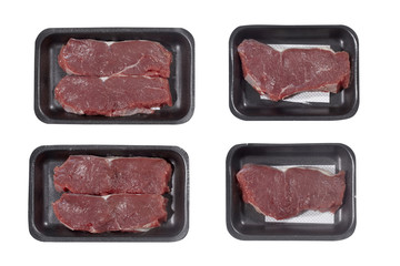 Supermarket plastic tray with veal isolated on white background. Top view
