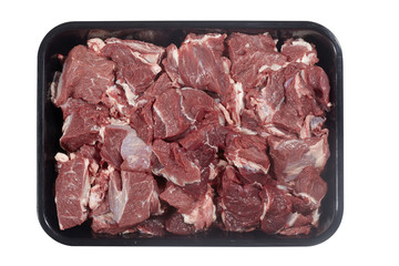 Plastic tray with lamb meat isolated on white background. Top view
