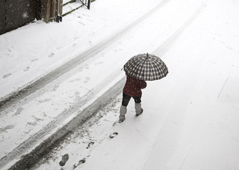 Woman walking in snow