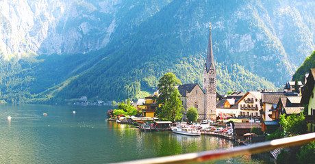 cityscape with a view of the lake and the old church in the town of Hallstatt in Austria, panorama - obrazy, fototapety, plakaty
