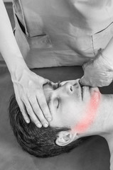 Physiotherapist is doing intraoral technique of massage masseter muscle. Osteopathy