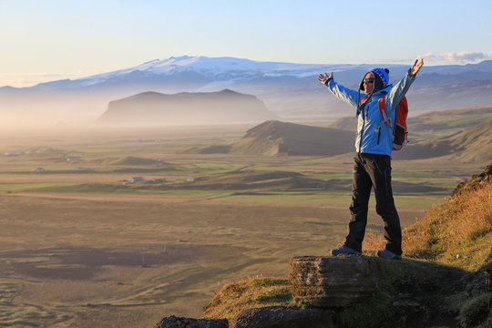 Young woman enjoying the beauty of Iceland landscape