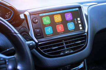 Car infotainment board display with apps. Modern car interior.