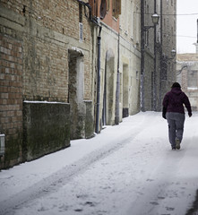 Fototapeta na wymiar Woman walking in snow