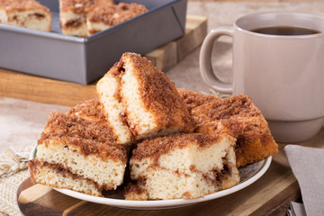 Pile of cinnamon swirl coffee cake on a plate