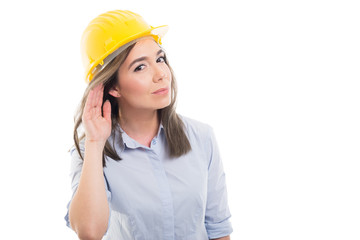 Portrait of female constructor showing can't hear you.