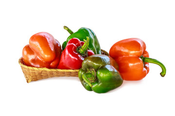 The bell pepper in the bamboo basket isolated on white background with clipping path.