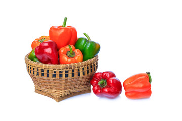 The bell pepper in the bamboo basket isolated on white background with clipping path.