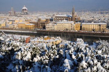 Cityscape of Florence after a snowfall in winter season, as seen from Piazzale Michelangelo. Italy.