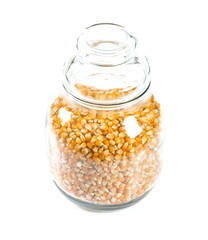 jar of dried corn isolated on white background