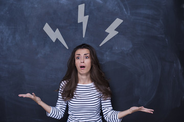 Beautiful young woman deciding with sketched arrows above her head