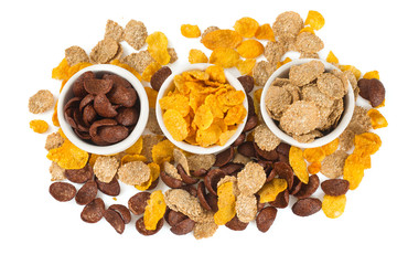 three types of breakfast flakes isolated on white