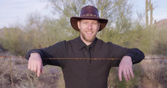 American rancher cowboy smiling directly into camera - happy industry