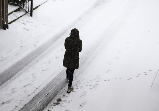 Woman walking in snow