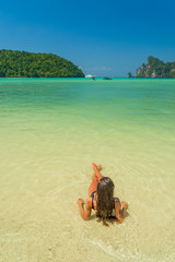 Woman relaxing on the beach in Koh Phi Phi Don in Thailand