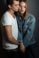 Handsome man and young woman in studio.