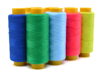Sewing threads multicolored on white background