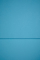 bright blue abstract background from colored paper