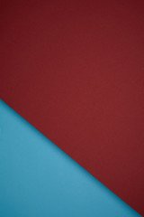 creative geometric background from red and blue colored paper