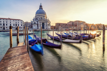 Fototapeta na wymiar Parked gondolas in Venice, Italy