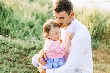 Fototapeta premium Young father with his cute little baby at home.
