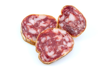 Top view macro detail of smoked salami slices, pepperoni slice, Italian prosciutto crudo ,raw ham texture isolated on white background , with clipping path.