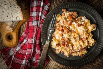 Scrambled eggs with sausage.