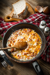 Scrambled eggs with sausage.