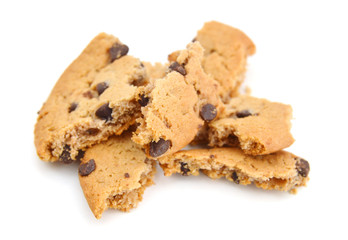 Closeup of crumbled chocolate chip cookie on white background