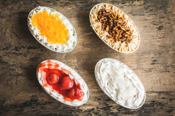 Top view group of delicious cupcake on wooden background