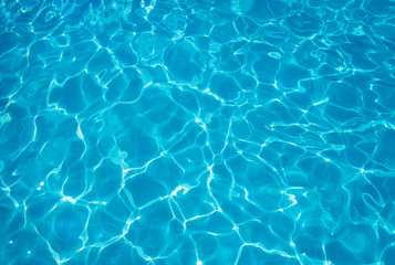 Fototapeta na wymiar Blue ripped water in swimming pool