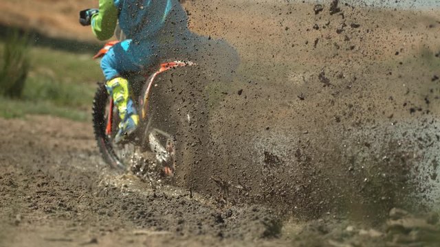 Motorcycle leaving mud behind