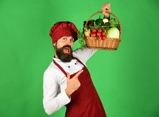 Young handsome gardener in burgundy apron